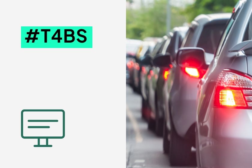 A long line of cars in a traffic jam next to the hashtag #T4BS and a monitor icon.